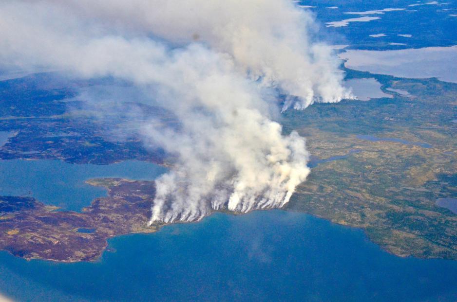 In 2014, megafires in Canada’s Northwest Territories scorched more than 7 million acres of forest, releasing half as much carbon back into the atmosphere as all the plants and trees in Canada typically absorb in an entire year. (Credit: NASA/Peter Griffith)