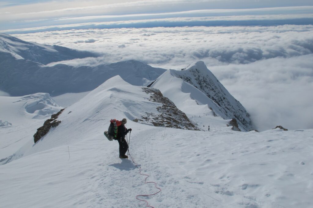 Members of a Dartmouth expedition climb to 14,000 feet on Denali for altitude acclimatization in 2013. The researchers extracted an ice core which contains a millennium of climate data in the form of gas bubbles, particulates, and compounds trapped in the ice. (Photo by Mike Waszkiewicz)