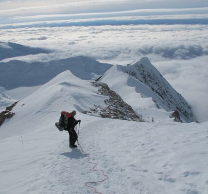 Members of a Dartmouth expedition climb to 14,000 feet on Denali for altitude acclimatization in 2013. The researchers extracted an ice core which contains a millennium of climate data in the form of gas bubbles, particulates, and compounds trapped in the ice. (Photo by Mike Waszkiewicz)