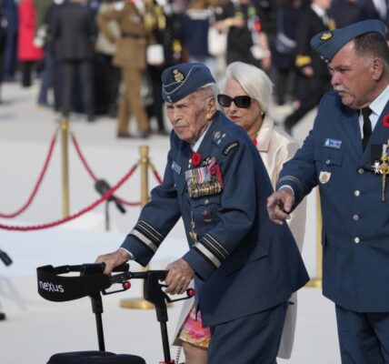 Richard Rohmer, left, one of the most decorated Canadian veterans, is shown at the Government of Canada ceremony to mark the 80th anniversary of D-Day, at Juno Beach, in Courseulles-sur-Mer, Normandy, France, Thursday, June 6, 2024. THE CANADIAN PRESS/Adrian Wyld