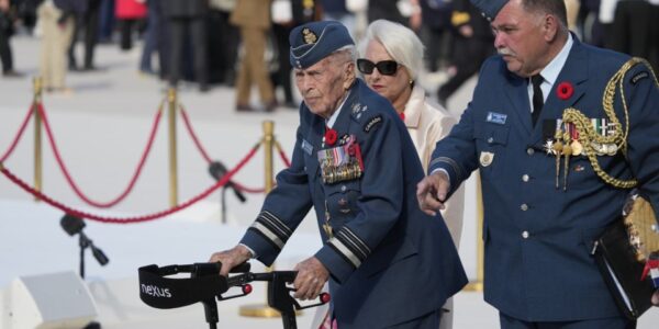 Richard Rohmer, left, one of the most decorated Canadian veterans, is shown at the Government of Canada ceremony to mark the 80th anniversary of D-Day, at Juno Beach, in Courseulles-sur-Mer, Normandy, France, Thursday, June 6, 2024. THE CANADIAN PRESS/Adrian Wyld