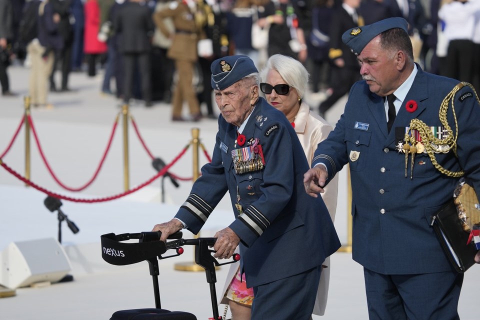 Richard Rohmer, left, one of the most decorated Canadian veterans, is shown at the Government of Canada ceremony to mark the 80th anniversary of D-Day, at Juno Beach, in Courseulles-sur-Mer, Normandy, France, Thursday, June 6, 2024. THE CANADIAN PRESS/Adrian Wyld