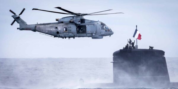 British Royal Navy Merlin MK2 Helicopter and French Navy Amethyste Attack Submarine, during NATO Steadfast Defender 24 off the coast of Norway. Photo: SHAPE NATO