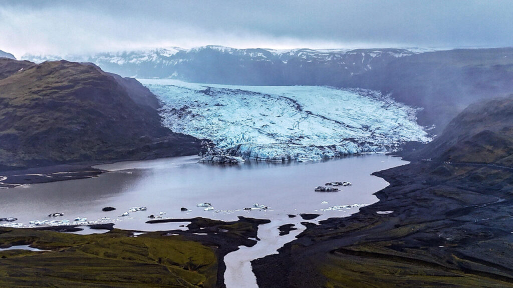 An aerial view shows the Vatnajokull glaciers meeting the mainland are melting into the ocean or forming lagoons due to global warming and climate change, February 2025 Image by picture alliance / Anadolu | Evrim Aydin ©