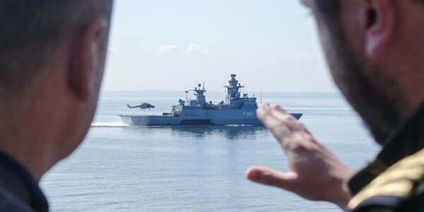 German Chancellor Olaf Scholz speaks with a serviceman as he stands aboard the frigate Mecklenburg-Vorpommern during his visit of the German Navy during a military maneuver in the Baltic Sea near Rostock-Warnemünde, northeastern Germany, on June 5, 2023. Photo: AFP