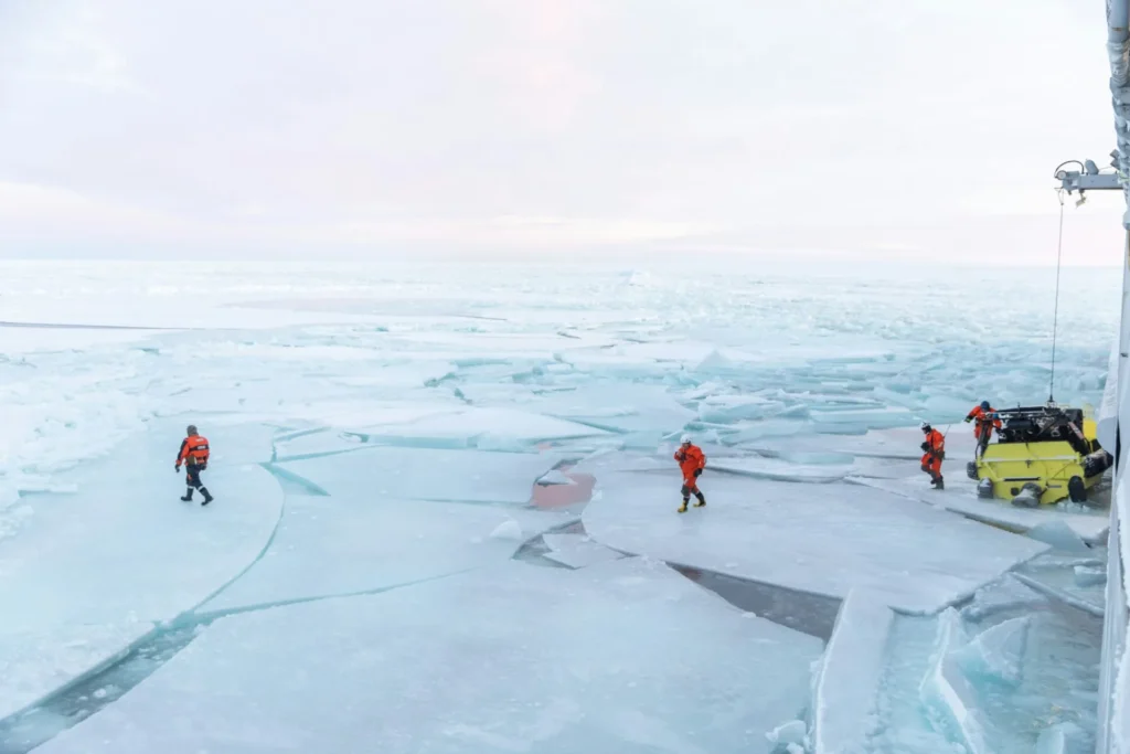 Coast guard works on ice in the Arctic region in January 2021 (Daniel Fatnes/Unsplash)