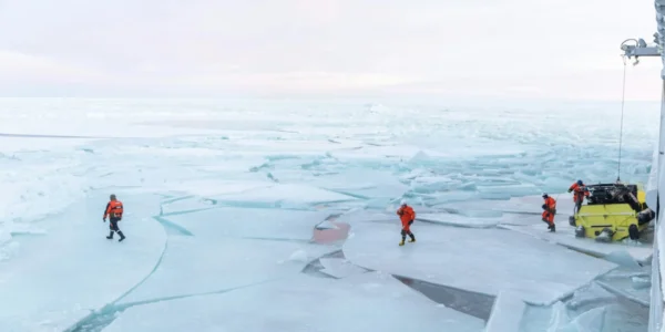 Coast guard works on ice in the Arctic region in January 2021 (Daniel Fatnes/Unsplash)