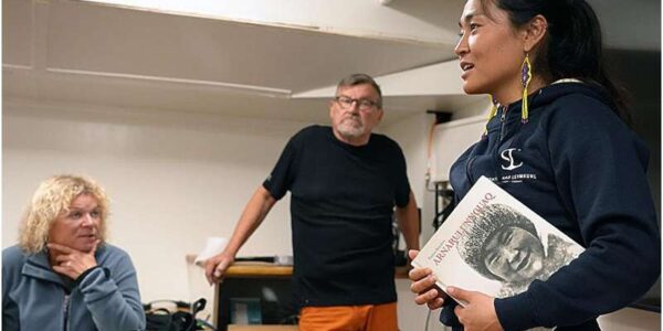 Miyuki Daorana (right) together with two lecturers from UiT; Ingvild Jensen and Jan-Erik Henriksen. The book Daorana is holding is about Arnarulunnguaq, who participated in one of the expeditions of the Danish adventurer Knud Rasmussen. Among other things, she mastered the art of carrying fire, protected by fish skin. Credit: Karine Nigar Aarskog/UiT