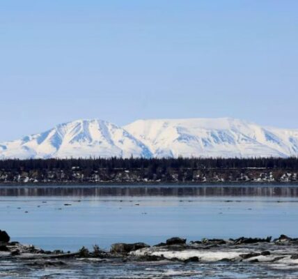 Mount Susitna is shown Friday, April 16, 2021, on the other side of Cook Inlet from downtown Anchorage, Alaska. No oil companies filed bids to drill in more than 400,000 hectares of Cook Inlet before the deadline Wednesday. (Mark Thiessen/AP)